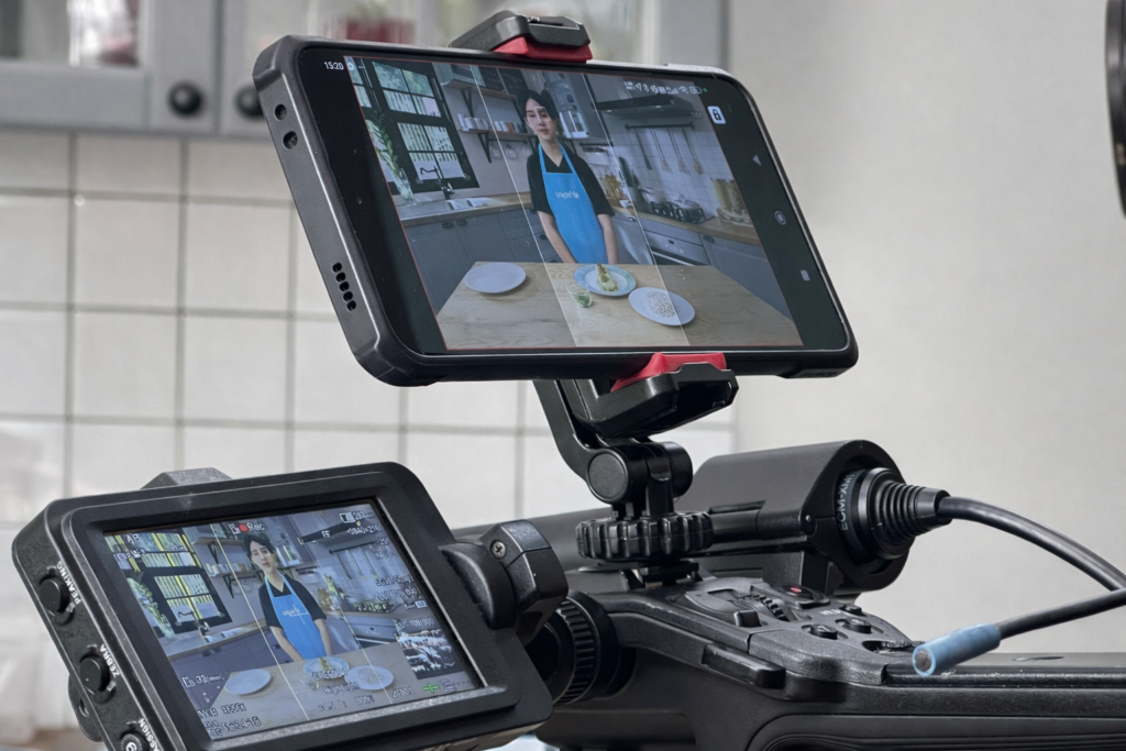 a screen of a camera which displays a filming in progress