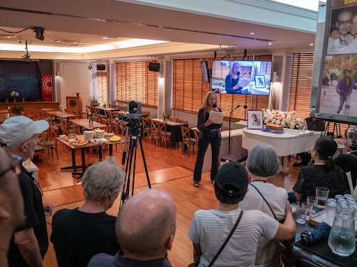 Jeanne Hallacy guided the celebration of Derek’s life at the Foreign Correspondents Club of Thailand with grace, warmth and empathy. Photo Credit: Jonathan Head